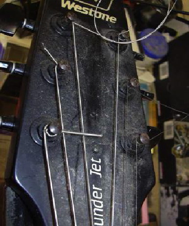 a badly strung guitar